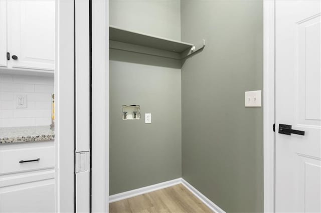 709 SW Graystone Dr, Grain Valley, MO 64029 - laundry area with light wood-style floors and hookup for a washing machine