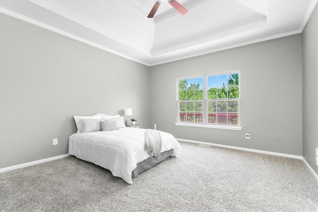 709 SW Graystone Dr, Grain Valley, MO 64029 - bedroom with a raised ceiling, carpet flooring, and a ceiling fan
