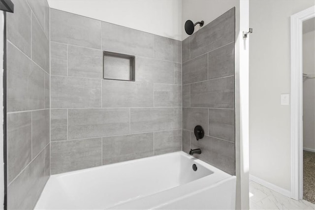 709 SW Graystone Dr, Grain Valley, MO 64029 - bathroom featuring marble finish floors and bathtub / shower combination