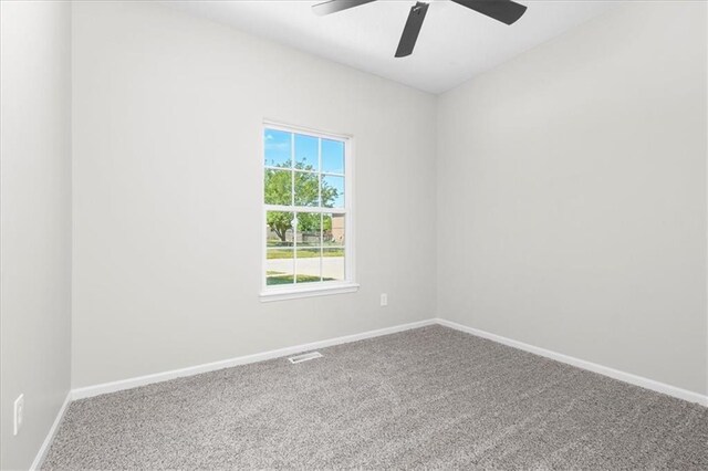 709 SW Graystone Dr, Grain Valley, MO 64029 - carpeted empty room featuring ceiling fan and baseboards