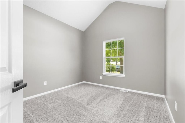 709 SW Graystone Dr, Grain Valley, MO 64029 - carpeted spare room with vaulted ceiling and baseboards