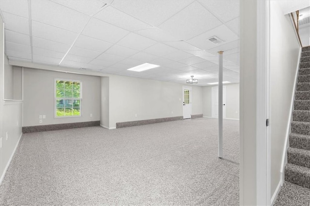 709 SW Graystone Dr, Grain Valley, MO 64029 - below grade area featuring stairs, carpet flooring, and a drop ceiling