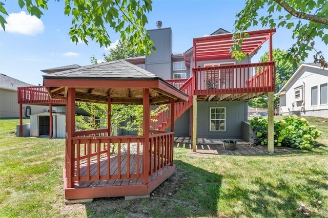 709 SW Graystone Dr, Grain Valley, MO 64029 - rear view of house with a deck, a yard, a gazebo, and a storage unit