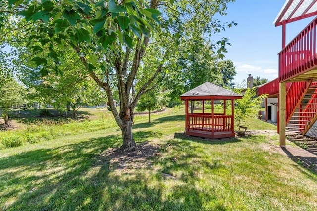 709 SW Graystone Dr, Grain Valley, MO 64029 - view of green lawn with stairs and a gazebo
