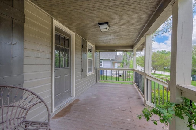 wooden terrace with a porch