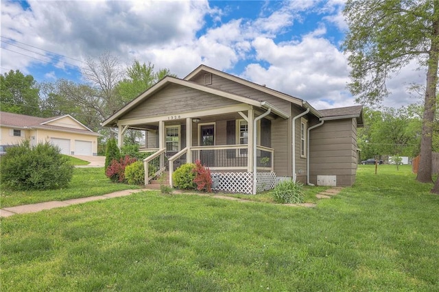 view of front of house featuring covered porch, a front lawn, and crawl space