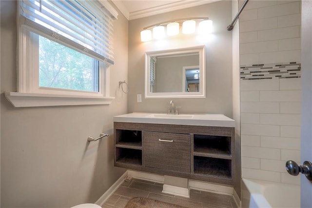 full bathroom with crown molding, baseboards, bathing tub / shower combination, and vanity