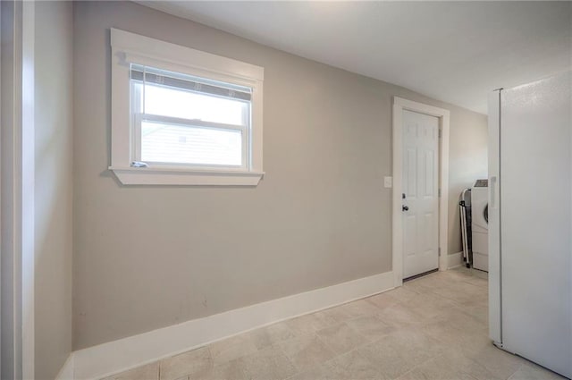 interior space with washer / clothes dryer and baseboards