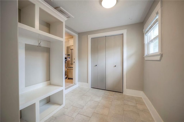 mudroom featuring baseboards