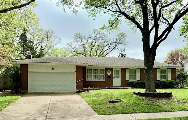 single story home with a front yard, a chimney, driveway, brick siding, and an attached garage