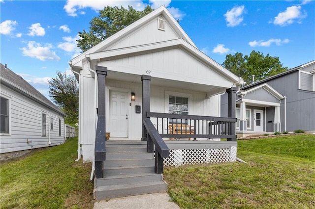 69 N Valley St, Kansas City, KS 66102 - view of front of property with covered porch and a front lawn