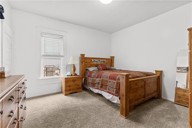 69 N Valley St, Kansas City, KS 66102 - bedroom with carpet floors, baseboards, and a textured ceiling