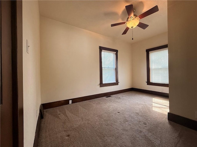 1450 Central St, Leavenworth, KS 66048 - carpeted empty room with baseboards and a ceiling fan