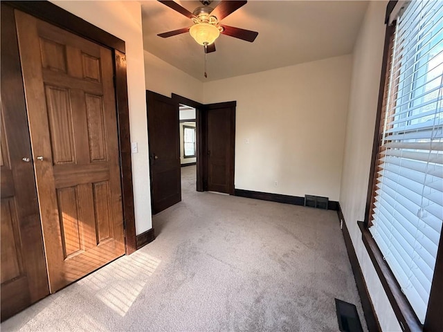 1450 Central St, Leavenworth, KS 66048 - unfurnished bedroom with carpet floors, baseboards, a ceiling fan, and visible vents