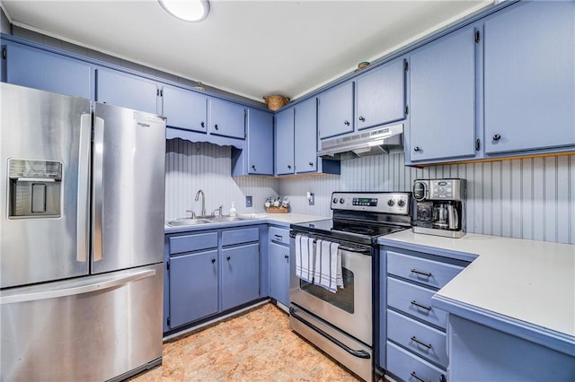 501 N Westwood Dr, Independence, MO 64050 - kitchen with a sink, light countertops, blue cabinetry, stainless steel appliances, and under cabinet range hood