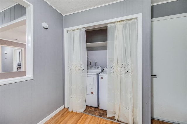 501 N Westwood Dr, Independence, MO 64050 - laundry area with laundry area, ornamental molding, wood finished floors, baseboards, and separate washer and dryer