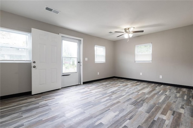 707 S Market St, Holden, MO 64040 - unfurnished room with visible vents, a wealth of natural light, and light wood-type flooring