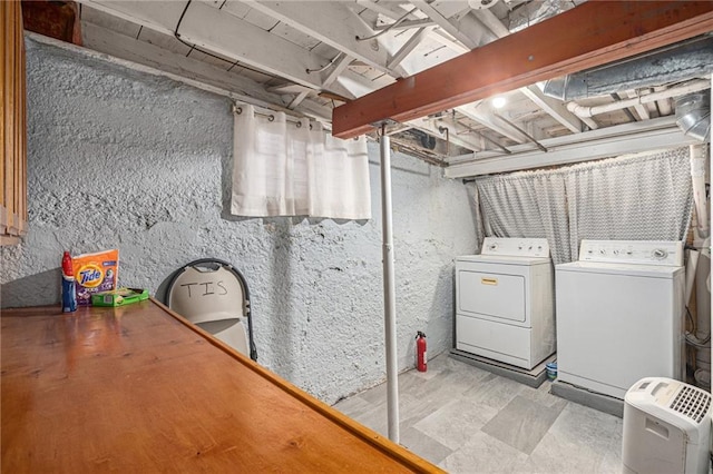 clothes washing area featuring laundry area and independent washer and dryer