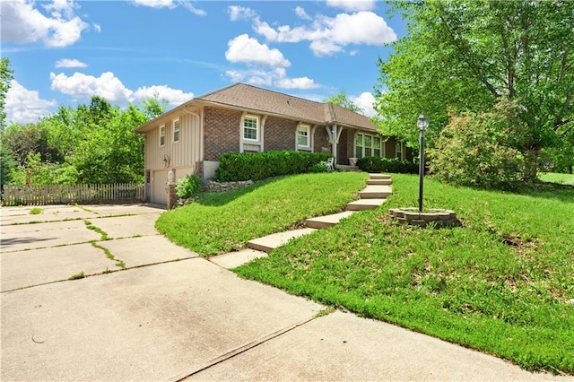 3311 S Crane St, Independence, MO 64055 - ranch-style home with concrete driveway, an attached garage, and brick siding