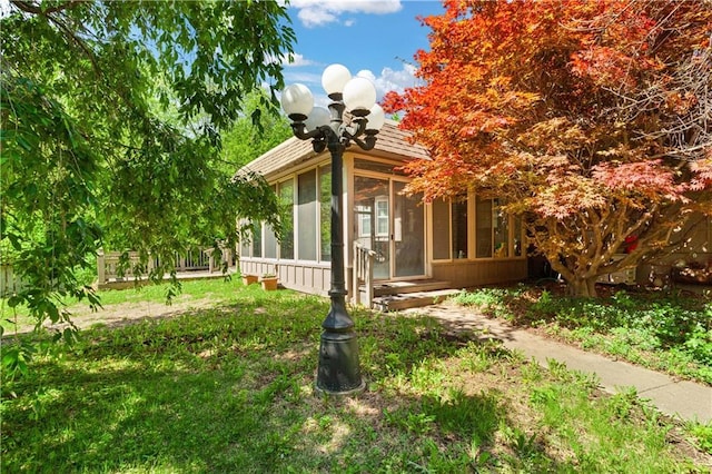 3311 S Crane St, Independence, MO 64055 - view of side of property featuring a sunroom and entry steps