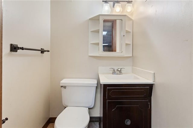 3311 S Crane St, Independence, MO 64055 - bathroom with vanity, toilet, and baseboards