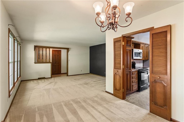 3311 S Crane St, Independence, MO 64055 - spare room featuring light carpet, a chandelier, and baseboards
