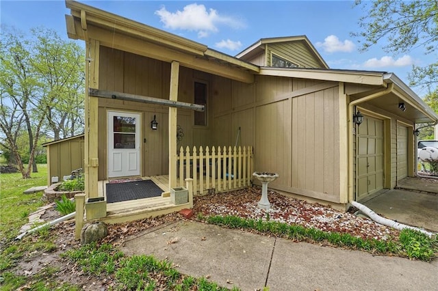 doorway to property with a garage