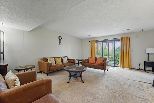 living area featuring a textured ceiling, light carpet, and baseboards
