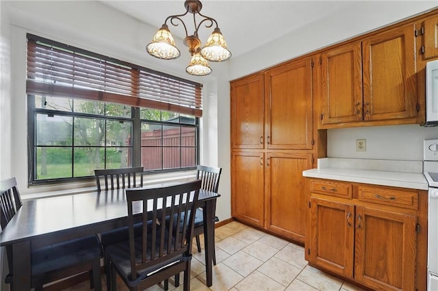 dining room featuring a chandelier and light tile patterned floors
