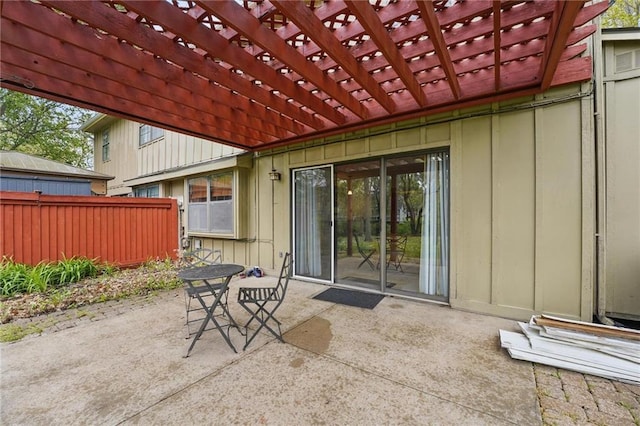 view of patio featuring fence and a pergola