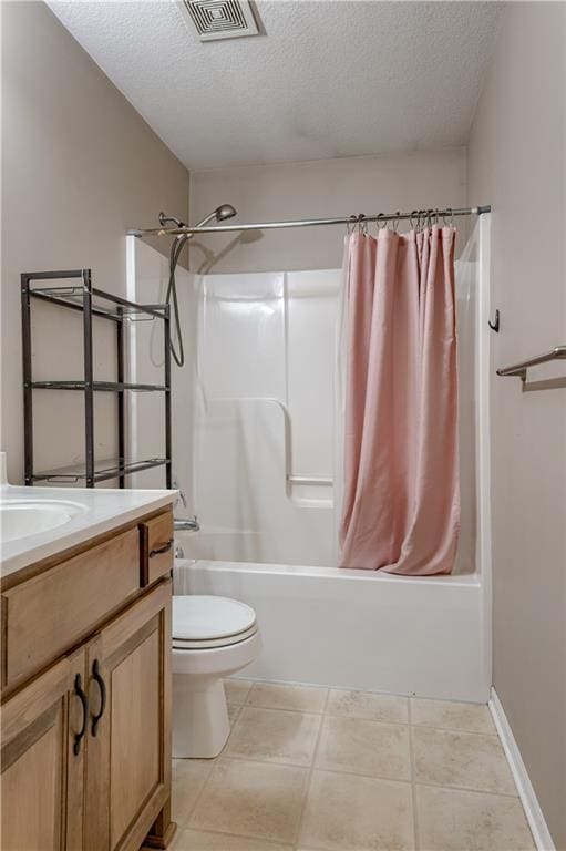 bathroom with vanity, shower / bath combo with shower curtain, a textured ceiling, toilet, and visible vents
