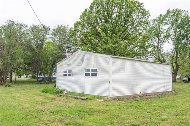 view of side of home featuring a yard