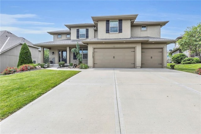 25203 W 97th Ter, Lenexa, KS 66227 - prairie-style house with stucco siding, a garage, concrete driveway, a front lawn, and covered porch
