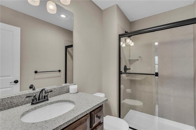 25203 W 97th Ter, Lenexa, KS 66227 - full bathroom featuring toilet, a shower stall, vanity, and recessed lighting