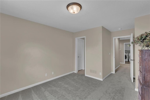 25203 W 97th Ter, Lenexa, KS 66227 - unfurnished bedroom featuring washing machine and clothes dryer, carpet flooring, and baseboards