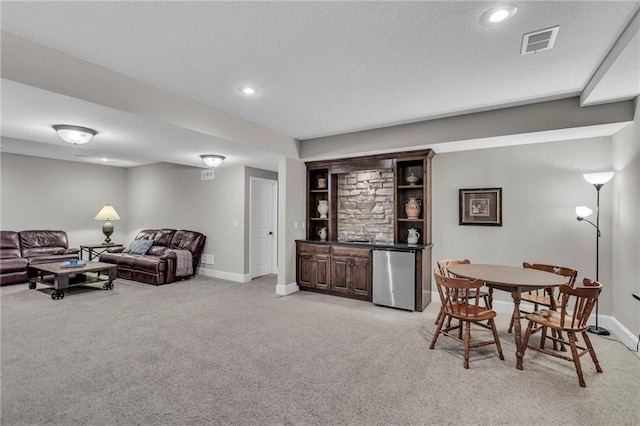 25203 W 97th Ter, Lenexa, KS 66227 - living room with light carpet, wet bar, baseboards, and recessed lighting
