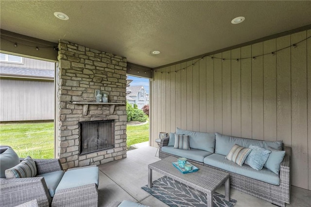 25203 W 97th Ter, Lenexa, KS 66227 - view of patio featuring an outdoor living space with a fireplace