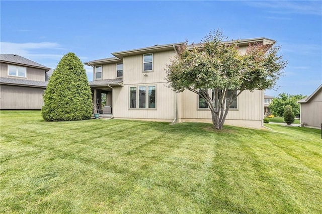 25203 W 97th Ter, Lenexa, KS 66227 - rear view of house featuring a lawn