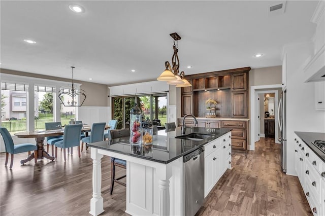 25203 W 97th Ter, Lenexa, KS 66227 - kitchen with a sink, stainless steel appliances, a kitchen island with sink, plenty of natural light, and recessed lighting