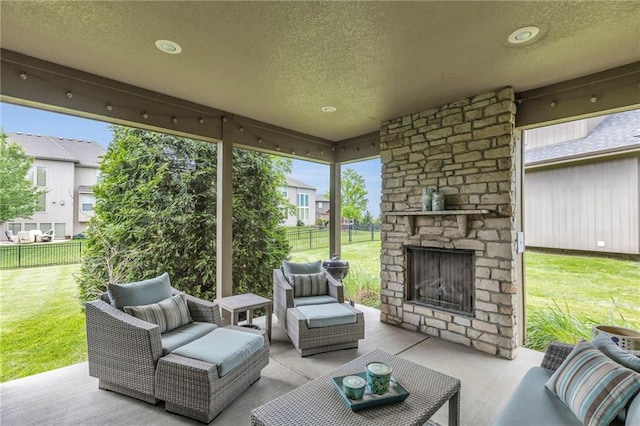25203 W 97th Ter, Lenexa, KS 66227 - view of patio / terrace featuring an outdoor living space with a fireplace and a residential view