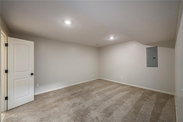 interior space featuring recessed lighting, baseboards, and electric panel
