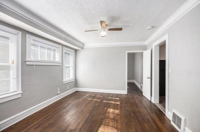 2922 Bales Ave, Kansas City, MO 64128 - empty room featuring a textured ceiling, crown molding, visible vents, wood finished floors, and a ceiling fan