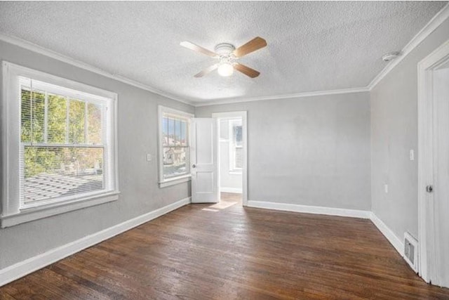 2922 Bales Ave, Kansas City, MO 64128 - unfurnished room featuring ceiling fan, crown molding, baseboards, a textured ceiling, and dark wood finished floors