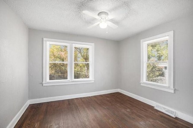 2922 Bales Ave, Kansas City, MO 64128 - unfurnished room with ceiling fan, a textured ceiling, visible vents, and a healthy amount of sunlight