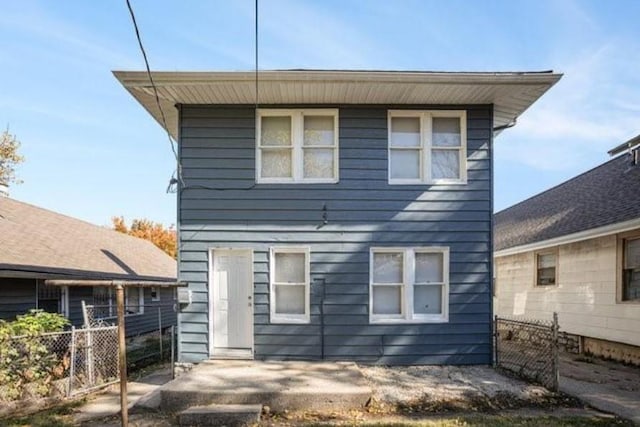 2922 Bales Ave, Kansas City, MO 64128 - back of property featuring fence and a patio area