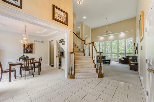 foyer entrance with light colored carpet, light tile patterned flooring, stairs, ceiling fan, and recessed lighting