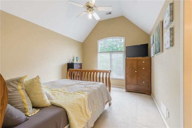 bedroom featuring light colored carpet, vaulted ceiling, a ceiling fan, and baseboards