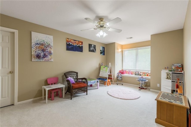 rec room with carpet flooring, ceiling fan, and baseboards