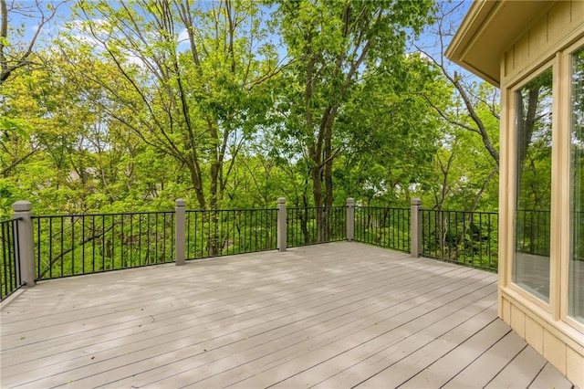 deck featuring view of scattered trees