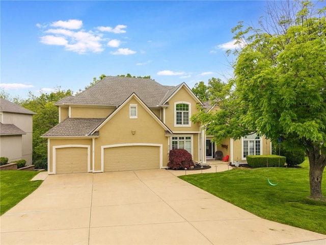 traditional home featuring concrete driveway, stucco siding, a front yard, and a garage